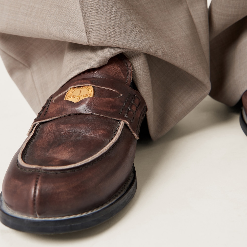 Miu Miu Vintage-effect leather penny loafers Ebony