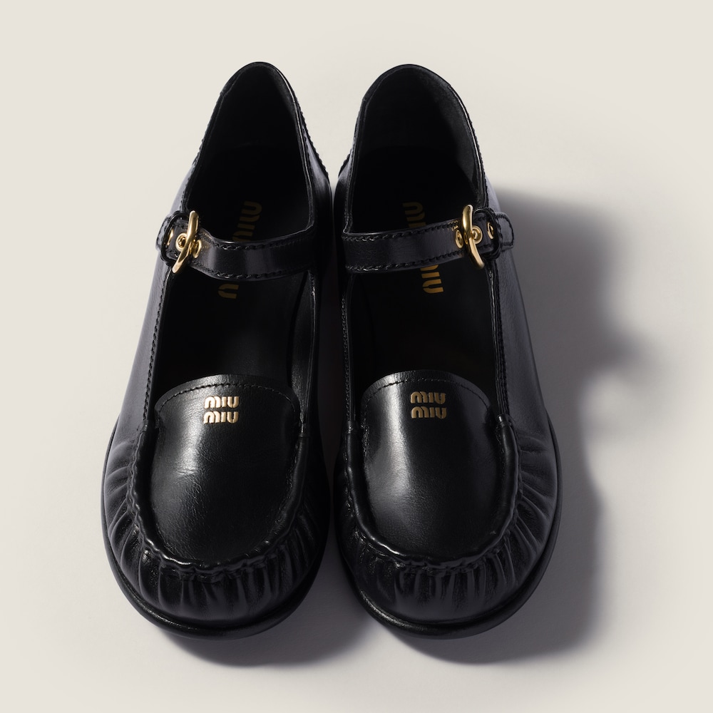 Miu Miu Leather loafers with strap Black