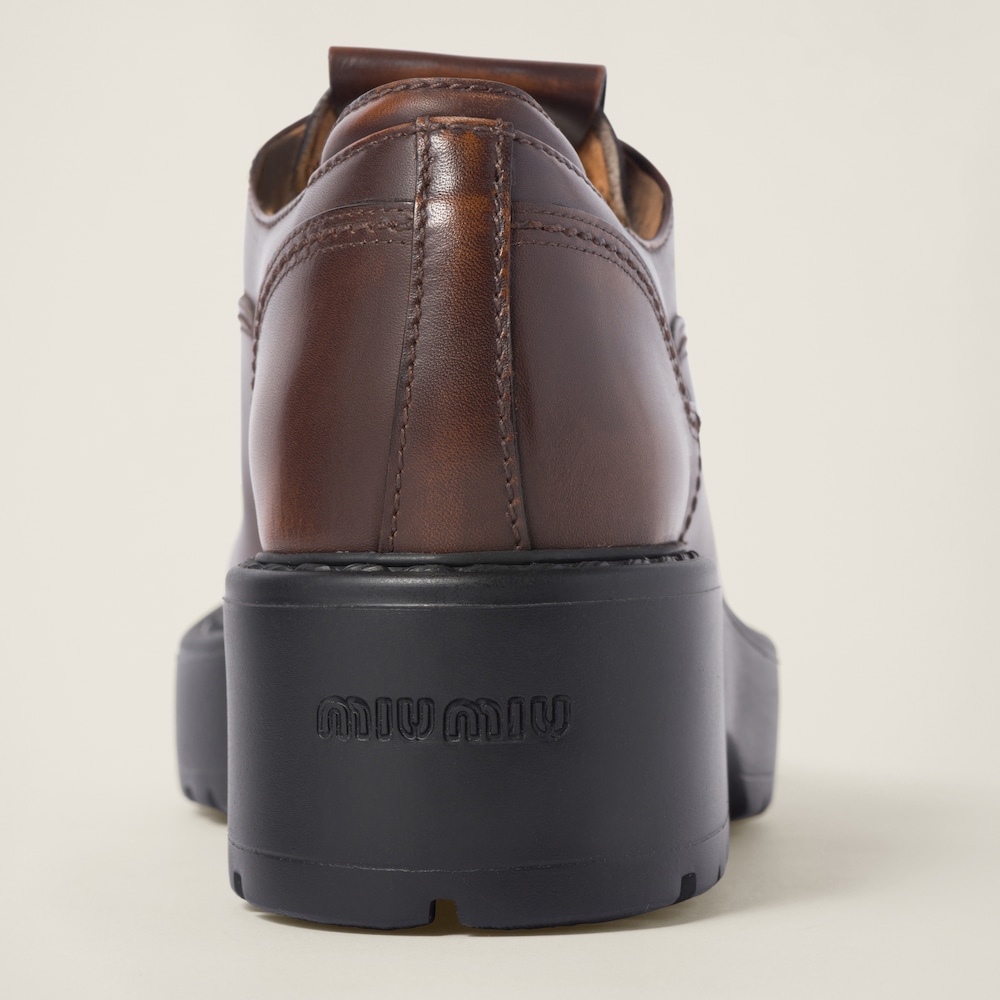Miu Miu Laced fumé leather shoes Sienna