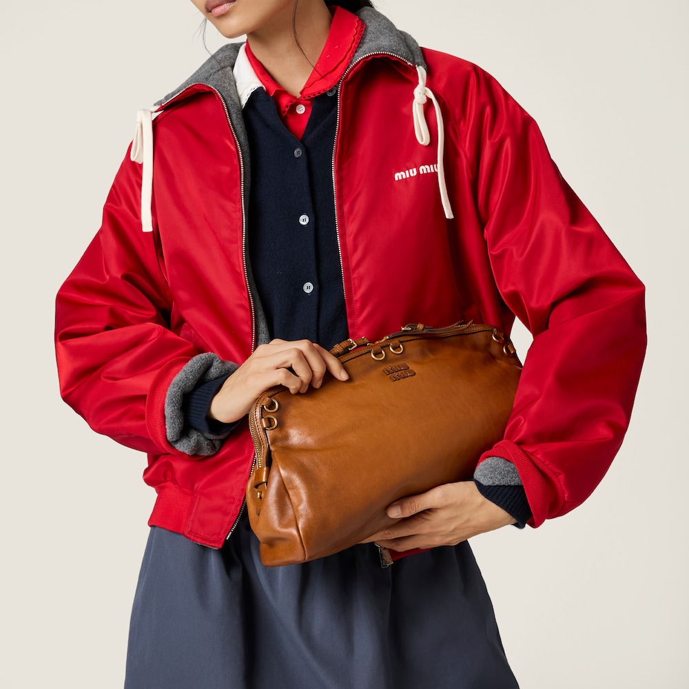 Miu Miu Caprice leather clutch Cognac