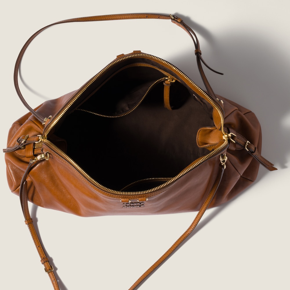 Miu Miu Caprice leather clutch Cognac